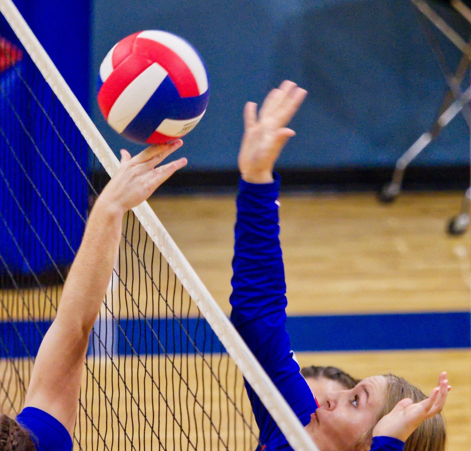 Annabelle Popex wins a battle at the net. [view more volleyball shots]